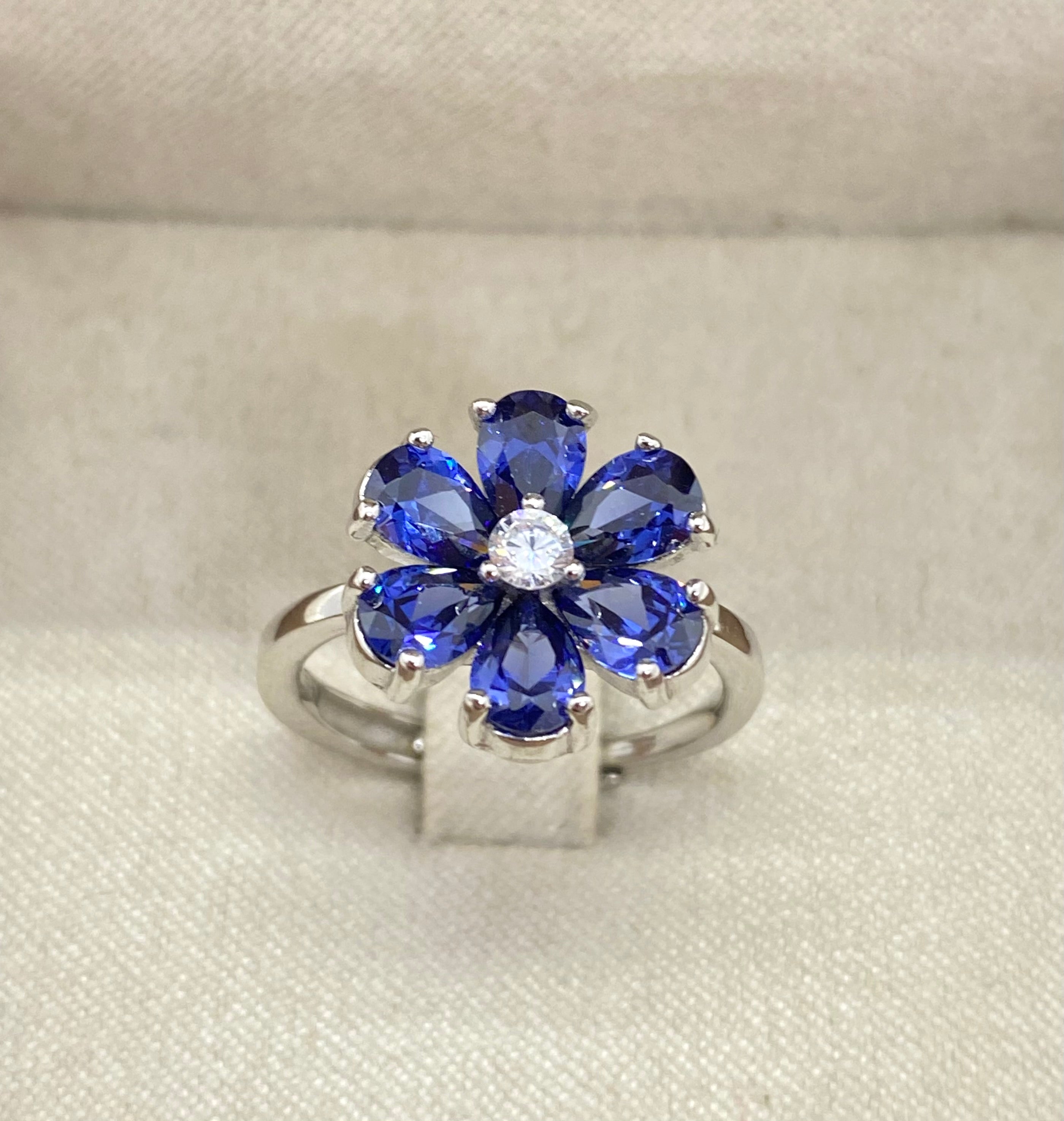 Anello petali blu luccicanti