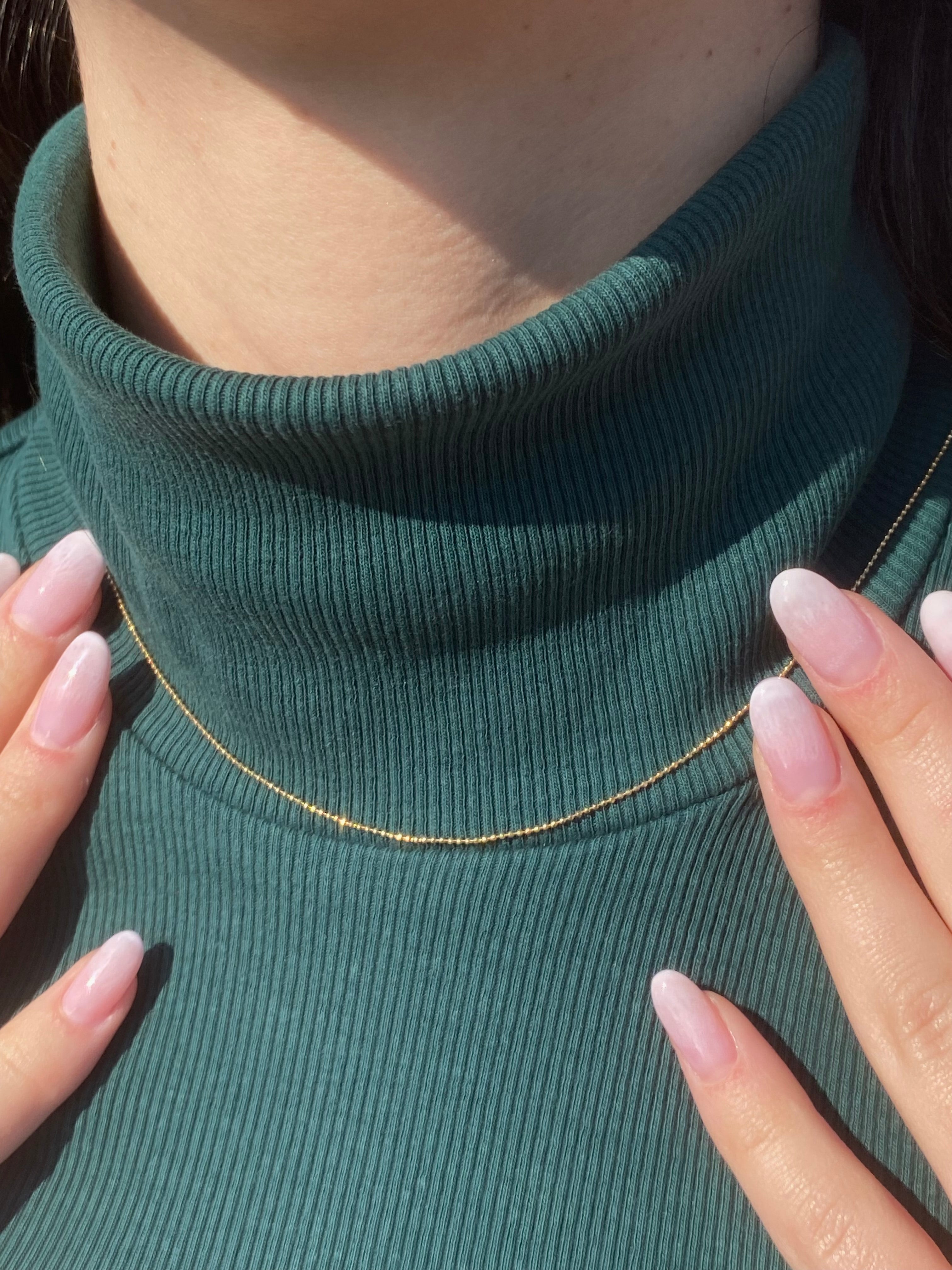 Necklace with micro spheres
